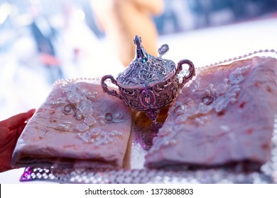 Silver Family Heirloom With Tablecloths On A Tray On Women's Hands At A Wedding