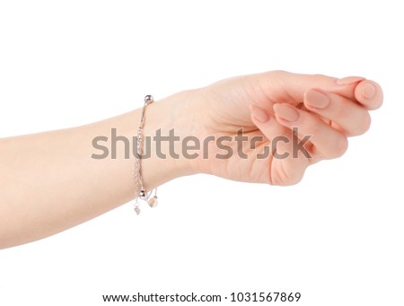 Silver female bracelet on a hand on a white background isolation