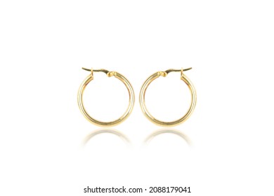 silver female earrings on a white background