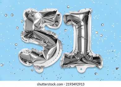 Silver Foil Balloon Number, Digit Fifty One On A Blue Background With Sequins. Birthday Greeting Card With Inscription 51. Top View. Numerical Digit. Celebration Event, Template.