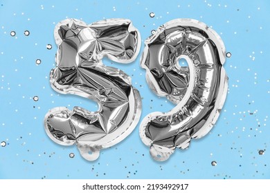 Silver Foil Balloon Number, Digit Fifty Nine On A Blue Background With Sequins. Birthday Greeting Card With Inscription 59. Top View. Numerical Digit. Celebration Event, Template.