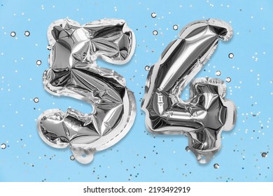 Silver Foil Balloon Number, Digit Fifty Four On A Blue Background With Sequins. Birthday Greeting Card With Inscription 54. Top View. Numerical Digit. Celebration Event, Template.