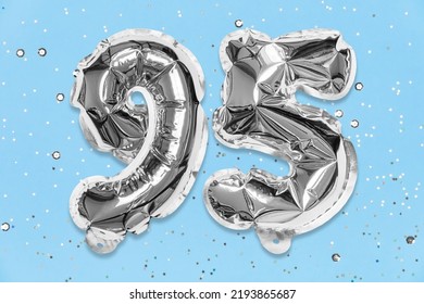 Silver Foil Balloon Number, Digit Ninety Five On A Blue Background With Sequins. Birthday Greeting Card With Inscription 95. Anniversary Concept. Numerical Digit. Celebration Event, Template.
