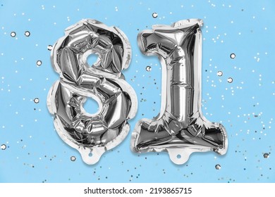 Silver Foil Balloon Number, Digit Eighty One On A Blue Background With Sequins. Birthday Greeting Card With Inscription 81. Top View. Numerical Digit. Celebration Event, Template.