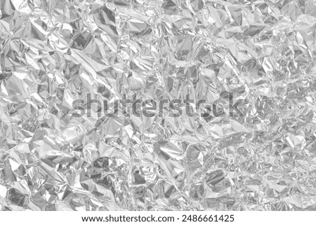 Silver foil leaf shiny texture, abstract grey wrapping paper for background and design art work.