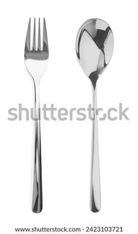Silver fork and spoon isolated on white, top view