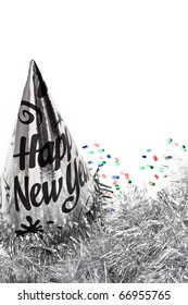 Silver Garland And New Year Party Hat Decorated With Colorful Confetti.