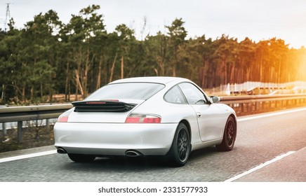 Silver German Roadster Coupe: Exquisite Speed and Style on the Majestic Highway. Modern European Sportcar. - Shutterstock ID 2331577933
