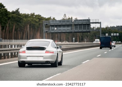 Silver German Roadster Coupe: Exquisite Speed and Style on the Majestic Highway. Modern European Sportcar. - Shutterstock ID 2342773117