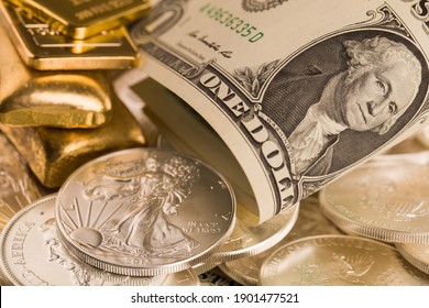 silver and gold bullion on the table - Shutterstock ID 1901477521