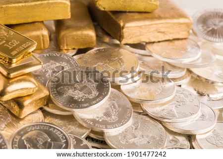 silver and gold bullion on the table