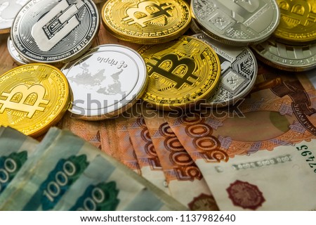 Silver Gold Crypto Coins litecoin LTC, bitcoin BTC, ripple XRP, dash . Russian ruble. Metal coins are laid out in a flat background, close-up view from the top, crypto currency exchange of money.