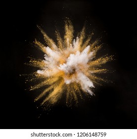 Silver And Gold Powder Explosion On Black Background. Freeze Motion.