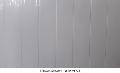 Silver gray background reflecting light shadows.