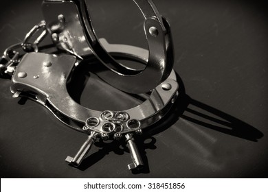 Silver handcuffs and keys