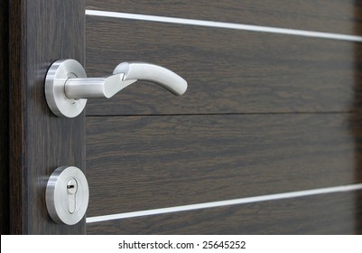 A Silver Handle With Pvc Brown Door