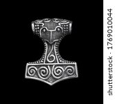 Silver jewelry. Pendant on the neck. Amulet. Occult symbolism. Paganism of the Vikings. Symbol of courage. Thor