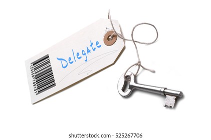 A silver key with a tag attached with a Delegate concept written on it.