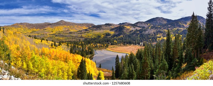 Silver Lake by Solitude and Brighton Ski resort in Big Cottonwood Canyon. Panoramic Views from the hiking and boardwalk trails of the surrounding mountains, aspen and pine trees in Utah Wasatch USA