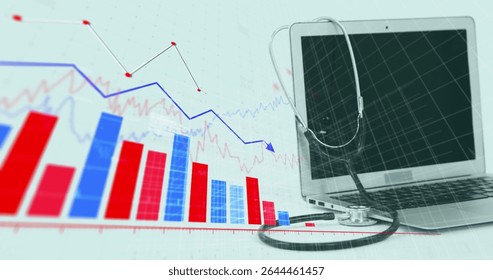 Silver laptop draping stethoscope in workspace, showing red-blue charts and graph, copy space. Technology, health, data, analytics, digital, innovation, medical