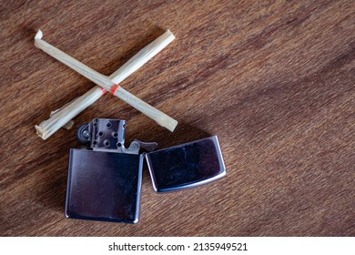 Silver Lighter On A Table.