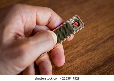 Silver Lighter On A Table.