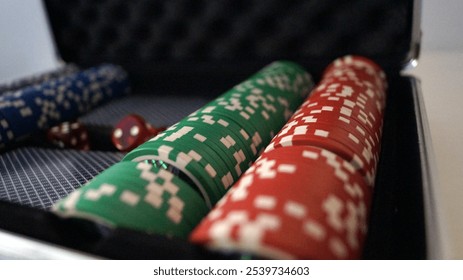 Silver metal briefcase with poker chips and cards open isolated against a white background - Powered by Shutterstock