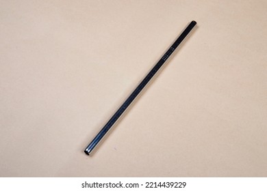 Silver Metal Straw On A Beige Background