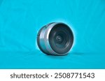 Silver metallic colour of mini compact interchangeable lens for small compact mirrorless or dslr camera gear.