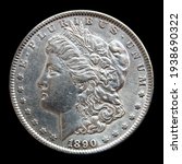 Silver Morgan dollar 1890 on black isolated background