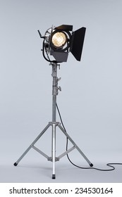 Silver Movie Studio Light On A Metal Stand Isolated On Grey Background