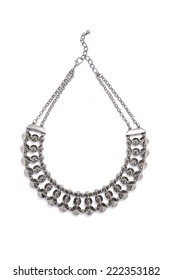 Silver Necklace Studded On A White Background