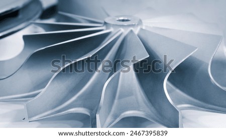 A silver object with a spiral design. The spiral design is made of metal and is very shiny