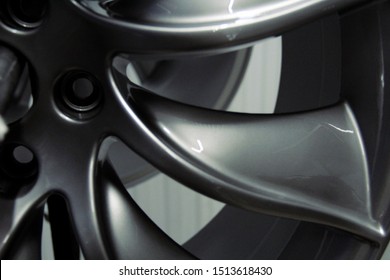 Silver painted wheel close up. Rims of premium class car. Glossy style with grey color. photo from paint shop for high class vehicles