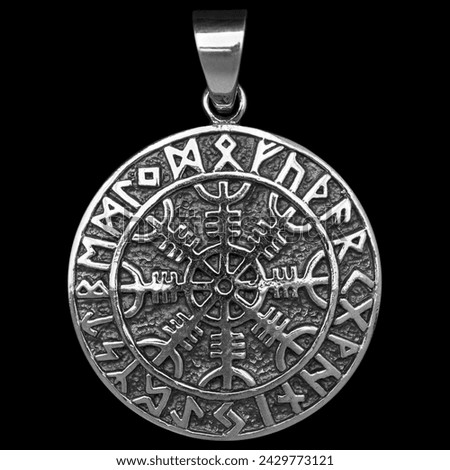 Silver pendant. Helmet of horror. Runic compass, futhark, runes, ravens and wolves of Odin. Viking style. Nordic tradition. Amulet. Valknut. Drakkar. Asatru Valhalla and Asgard.