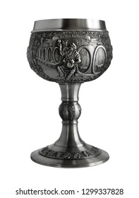 Silver or pewter wine goblet bas-relief and Latin inscription - In Vino Veritas. Photo with a shallow depth of field 