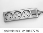 Silver power strip cropped against a white background