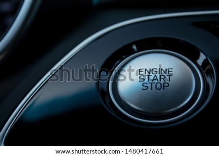 silver reflective car electronic push to start ignition.