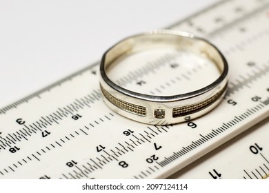 Silver ring on measuring instrument, pawnshop