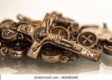 silver rosary with crucifix in closeup on white background