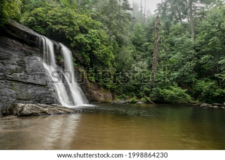 Silver Run Falls, a beautiful waterfall in Nantahala National Forest near the town of Cashiers in the North Carolina mountains, plunges into a swimming hole at its base.