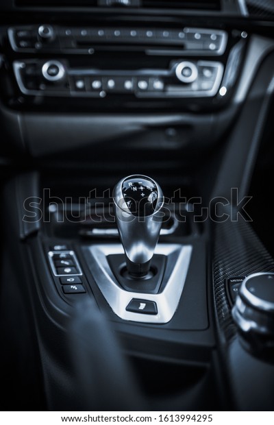 silver shift knob of a\
sportscar