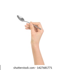 Silver Spoon In Women Hand Isolated