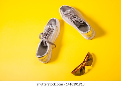 Silver Sport Boots And Sunglasses On Retro Color Background. Fas