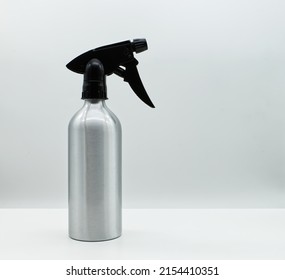 Silver spray bottle isolated on white background. Spry bottle without label for house cleaning. Cleaning service concept. - Powered by Shutterstock