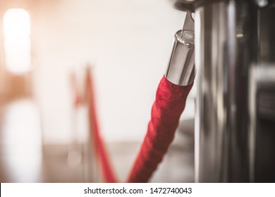 Silver stanless stanchion with red rope barrier - access control - VIP only  - Shutterstock ID 1472740043