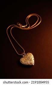 Silver star engraved heart-shaped locket