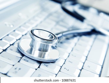 Silver stethoscope on modern silver keyboard - Powered by Shutterstock