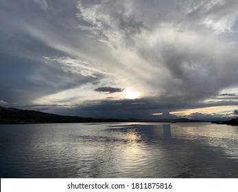 Silver sunset on famous lake Titicaca, Peru. Impressive cloudscape over glittering water surface. Romantic quiet twilight. Beautiful natural lake scene. Silvery sky color. Wonderful meditation nature. - Shutterstock ID 1811875816