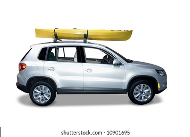 Silver Suv With A Kayak On Top. Isolated On A White Background With A Shadow Detail Drawn In Under The Car. Clipping Path For The Car And Kayak Is Included.